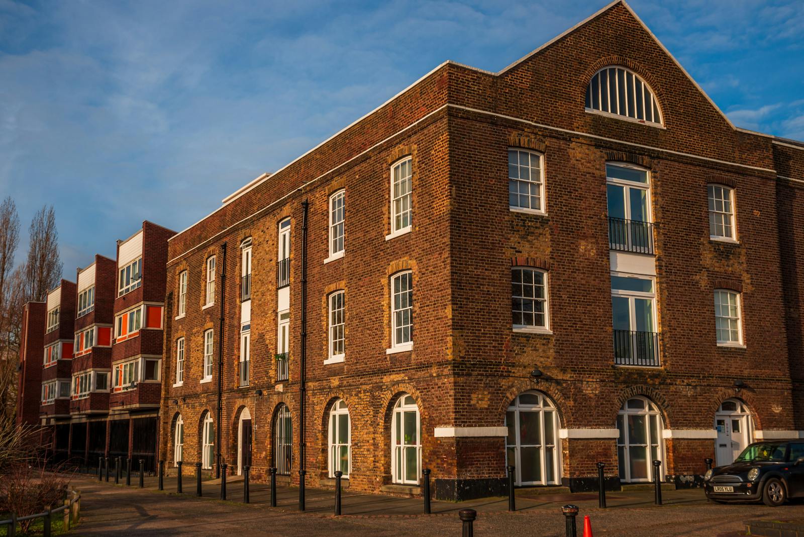 A classic brick building facade captures London's architectural charm in a sunny street view.